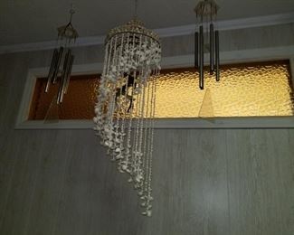 https://ctbids.com/#!/description/share/697701 3 Wind Chimes, one is a shell with metal birds 40" h x 12", 2 metal wind chimes 30"h x 6"


