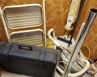 https://ctbids.com/#!/description/share/697741 Includes vacuum cleaners, step stool, brooms and suitcase.


