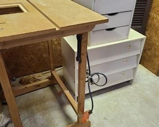 https://ctbids.com/#!/description/share/697746 Saw table measures 31" x 24" x 37". Small three drawer compartment measures 15" x 15" x 15" drawers measure 12" x 4". Three door shelf compartment has half shelves that don't go all the way to the back. Measures 27" x 14" x 23". Comes with six shutters made of plastic.

