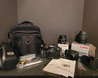 https://ctbids.com/#!/description/share/697659 This set includes two Canon cameras. EOS 650 35mm camera with a 50mm, 35mm and 28 mm lenses and a carrying case and manual, Canon Digital Power Shot camera with manual. 

