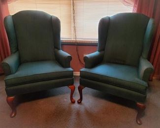 https://ctbids.com/#!/description/share/697692 Two green wingback chairs. They are still in solid condition. No scratches, just a few spots that may be cleaned or covered. The chairs are 43" tall at the back and 20" to the seat. The base is 26" x 30" wide.

