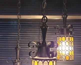 https://ctbids.com/#!/description/share/697658 This is a beautiful piece with a little Moroccan flair. Antique bronze with multi colored glass. Each glass pendant  is 12" long and 5" across. The height from the ceiling can be adjusted, and this light can plug in anywhere.

