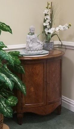 Wood accent cabinet (alternate view) with Buddha and faux flower