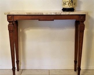 Small wood and marble console table. Great for anywhere! It's hard to find one this size.
