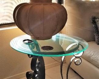 Great lamp and small round glass and metal side table.