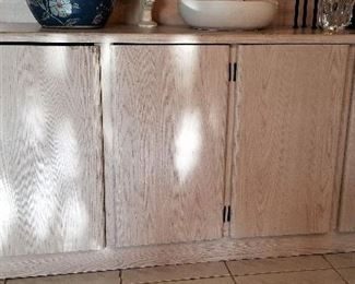 Light wood cabinet console.
