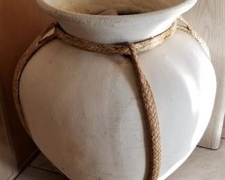 Large white pottery vessel with roping.