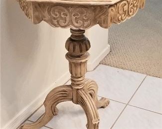 Small side table with black marble top.