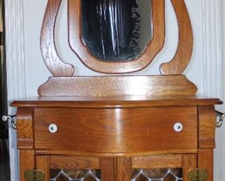 Pulaski Furniture Company Keepsake Collection Golden Oak Wash Stand with Brass Rod Towel Bars on each end,  Leaded Stain Glass Double Doors with a Harp Adjustable Mirror
