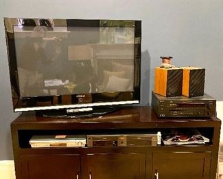 Flat screen tv, Sony STR- DE895 AM/FM Stereo receiver, ADS - L300 Speakers, Go Video DVD-9500, Panasonic SA-HT740 5 Disc Player, and storage cabinet for all of it!