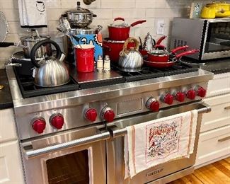 Kitchen is loaded with useful things...from silverware to dish ware, pans and pots to espresso makers and art! Fun old cookbook collection too!