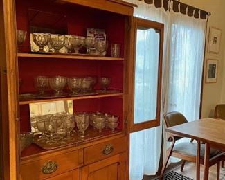 Antique hutch and unique collection of depression glass goblets