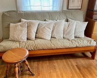 modern futon with pillows