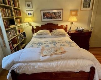 Bedroom view with many books, antique dresser
