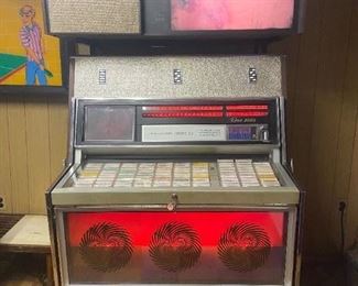 1969 Rowe Music Miracle Jukebox. 200 count musical selection. This jukebox is customizable. Jukebox has two viewing projectors. One projector plays slides continuously & the other projector plays video slides on a Phono Vue above the unit. This jukebox was owned & maintained by a jukebox & arcade mechanic. Many extra parts, lights & manuals for this jukebox.