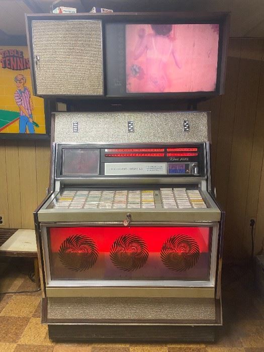 1969 Rowe Music Miracle Jukebox. 200 count musical selection. This jukebox is customizable. Jukebox has two viewing projectors. One projector plays slides  continuously & the other projector plays video slides on a Phono Vue above the unit.  This jukebox was owned & maintained by a jukebox & arcade mechanic. Many extra parts, lights & manuals for this jukebox.