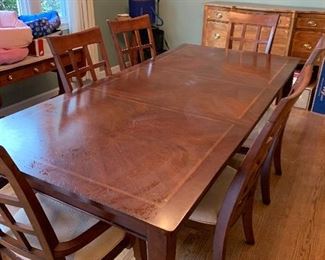 Dining table shown with leaf in