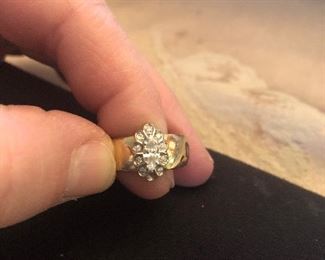 14k yellow gold wedding ring marquis Center stone smaller diamonds around. Approx. Size 6  looks like it could be sized a little. Good gold weight $375 as is missing 1 small  stone not expensive to replace  