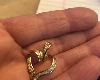 14k yellow gold heart pendant w/ baguette and round diamonds.  Great Valentine’s  or just for a heart lover. Price $200