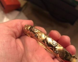 Fabulous 14 k gold bangle 2 tone (rose gold hearts ) with diamond accents. $575 