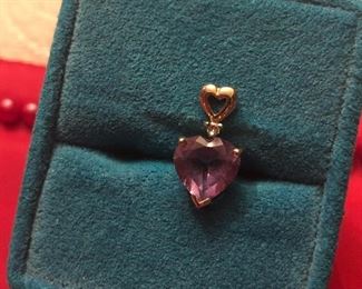 Tiny 10 k yellow gold amethyst and diamond pendant. Will need a Tiny chain perfect for a young gal for Valentine’s  $45 