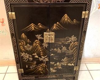 Asian Inspired Two Door Cabinet - very nice cabinet with an Asian flair! Measures 24" x 12" D x 36" H. Very small ding ton top left corner and some light wear to the edges. 