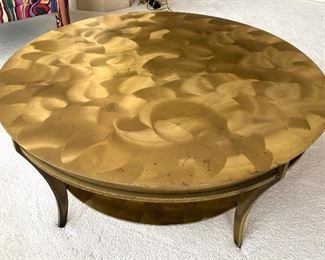Simply Stunning Brass Round Coffee Table in an amazing burnish/brushed finish. This does have some slight wear issues on the top including "ring" marks from drinking glasses. However, it does not take away from the beauty of this truly stunning table! It is quite heavy and measures at 17" H and 38" across.