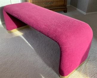 Contemporary Curved Upholstered Bench in a beautiful shade of magenta. Measures 47" L x 19" H