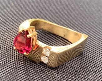 14k Robert C Trisko Ring. The gemstone looks to be a ruby, however; could be garnet. The inside 14k stamp has worn off. However; one can read about Trisko jewerly which this ring is hallmarked, "Trisko" and know this amazing designer works with gold. Weight is 10.34 grams. 
