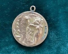 $35  Art Nouveau GF repousse locket, 1 1/2"