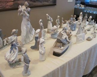 Table full of Lladro Figurines.