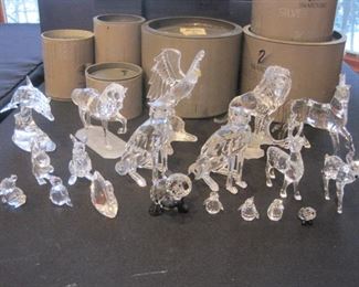Table full of Swarovski Crystal Figurines.