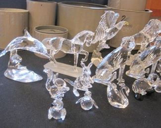 Table full of Swarovski Crystal Figurines.