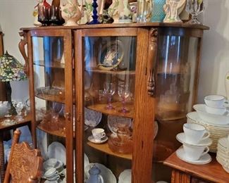 Two extra wide curio China cabinets with key. Set of Noritake China, 3 different sets of Pfaltsgraff dishes, heavy grape colored water glasses, too much to list!