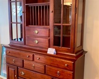 Lot 4804. $650.00  "Ducks Unlimited" by Kincaid, 2 pc china cabinet; the base has 7 drawers and two cupboard spaces with doors.  The top of the cabinet has two drawers and a 2 lit display areas behind glass doors. The middle section has a single shelf and a plate rack.  Workmanship is top notch and is Made in the USA!	53" W x 17" D x 83" H	