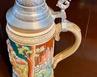 Lot 4810. $25.00   Limited Edition #1328 - West Germany, Ceramic stein with pewter lid. The Walt Lim Ed - DF10000 on bottom 12" H x 3.5" Diameter	