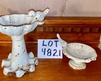 Lot 4821. $26.00. Two whimsical table top cast iron or heavy metal bird feeders, intentionally distressed, rusted, whitewashed  with cute birds perched on rims.	7" and 2.5" H	