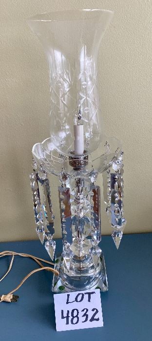 Lot 4832. $225.00. Beautiful Vintage Crystal Lamp, purchased by wealthy friend of owner's family emigrating from Italy to the US, c. 1930-1940s.  Lamp is 24" tall, with a crystal 11" hurricane shade sitting atop a crystal dish with ten 10" Crystal pendants, on a solid crystal base with a 5.5" square bottom.  The lamp is 8" wide at its widest point. Electric light with on-off switch on the cord.  Just stunningly lovely.  		