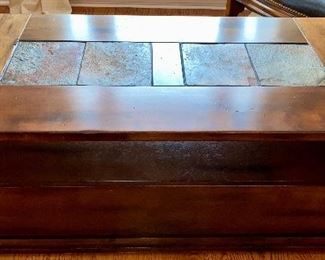 Lot 4838 $175.00. "Santa Fe" by Mission Furniture Style Coffee Table with Storage and tile or slate inserts on the top, measuring 24"tall, 18" deep x 48" long.  Again, dove tailed construction make this line a tribute to form and function.   