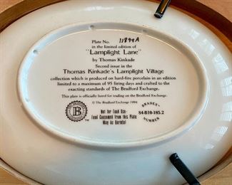 Lot 4842. $45.00 Set of 3 Thomas Kinkade framed oval collector plates 11.5" with wood frame and 9.25" plate alone.  From the Lamplight Village Collection - 1) Lamplight Brooke, 2) Lamplight Lane, 3) Lamplight Inn with Vanhygan & Smythe frames.