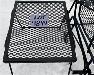 Lot 4844. 	$235.00  Wrought Iron Patio Glider (39" Long x 35" high x 29" deep) and Side Table (18" long x 14" wide) by Meadowcraft.  Excellent Condition - when necessary, can be spray painted black to restore finish but right now looks awesome.  Quite heavy; will not be blowing over anytime soon!	