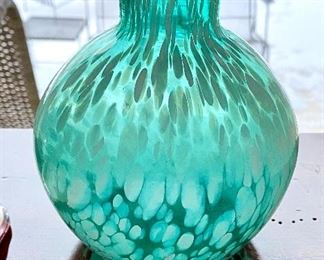 Lot 4814. $22.00  Hand-blown Turquoise glass "fat belly" vase with fluted mouth - appears to be in the style of Murano glass, with a pontil on bottom and white petals/flecks, 6" tall x 5" diameter. Looks lovely infront of a light source.  Bonus Two sweet metal plates with enamel paint of a strawberry and grapes, 5.5" x 5" made to look vintage but imported and cute.  		