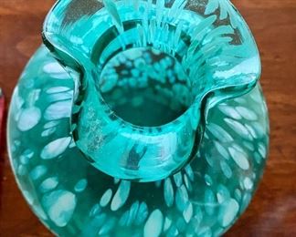 Lot 4814. $22.00  Hand-blown Turquoise glass "fat belly" vase with fluted mouth - appears to be in the style of Murano glass, with a pontil on bottom and white petals/flecks, 6" tall x 5" diameter. Looks lovely infront of a light source.  Bonus Two sweet metal plates with enamel paint of a strawberry and grapes, 5.5" x 5" made to look vintage but imported and cute.  		