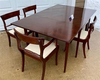 Lot 4856. $675.00  Morganton Drop Leaf Dining Table with three side chairs and one captain chair.  The drop leaf table has legs that swing out to support the drop leaf, very good condition. Needs only minor attention.   (Table: 73"L extended, 26" W  folded x 46" L) The cushions of the chairs may need to be re-upholstered eventually. (Chairs: 33" H back, seat 18"W x 16" D.  Coordinating hutch and sideboard are available as well.	