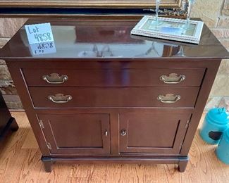 Lot 4858.  $375.00  Small Buffet/Sideboard by Morganton Furniture.  Storage behind doors and two drawers.  	37" W x 17" D x 34"H. Perfect Buffet or Bar.  Storage underneath and 2 Drawers. Pictured with Martini glasses
