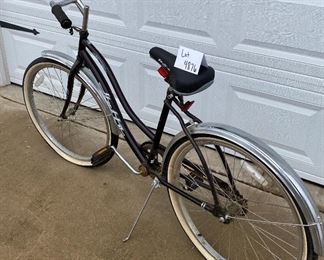 Lot 4876  $50.00  Vintage Black Santa Fe by Huffy Women's Cruiser  Bike  24"  with Eddie Bauer Seat and front/rear chrome fenders.  Tires need to be inflated.