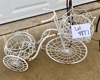 Lot 4877   $52.00  Gardeners Lot,  Cute thin metal Bunny, Wrought Iron Garden Trike planter with 2 baskets , and a metal plant stand/table.. Measurements:  Rabbit: 16" H; Tricycle 21" H x 27" L, Plant  stand: 12" W.
