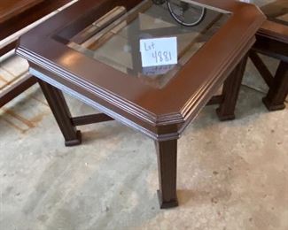 Lot 4881. $195.00  Unbranded but nice wooden cocktail table and side table pair, Dark wood with beveled smoky class inserts.  Very nice shape. Side table: 25.5" Square x  22" H.  Cocktail Table: 40" Square