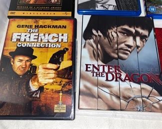 Lot DVD #13.  $35.00. 8 Mostly Classic Great vintage Movies on DVD:  "Enter the Dragon" Bruce Lee - Comes with a Moving motion photo of Lee karate chopping if you move it (its a hoot!) and other Studio Goodies, "The Magnificent Seven" - Spec. Edition, with Yul Brenner, Steve McQueen and Eli Wallach, "Lady from Shanghi" Orson Welles and Rita Hayworth, "Spartacus" starring Kirk Douglas and Lawrence Olivier, winner of 4 academy awards, "The French Connection," Starring Gene Hackman - won 5 academy awards including Best Picture and Best Actor 1971 (Who could forget the chase scene?), "Citizen Kane" starring Orson Welles, Blu-Ray, "Deliverance" featuring Burt Reynolds and Jon Voight and the Dueling Banjos(!), and Alfred Hitchcock's "North by Northwest" starring Cary Grant and Eva Marie Saint,  Mount Rushmore scenes are pretty iconic.  