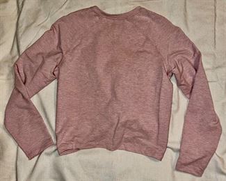 Lot 4899.  $100.00. Lululemon: 4 not so run of the mill sweatshirts! Dark Gray Cropped V-Neck Sweatshirt with bell sleeves, Chrome crop sweatshirt with abstract seams, the softest oatmeal crewneck sweatshirt, and a gathered front punk sweatshirt. All size small. 